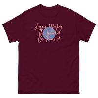 JESUS MAKES THE WORLD GO ROUND MAROON T SHIRT WITH PINK LETTERS AND BLUE CIRCLE IN MIDDLE
